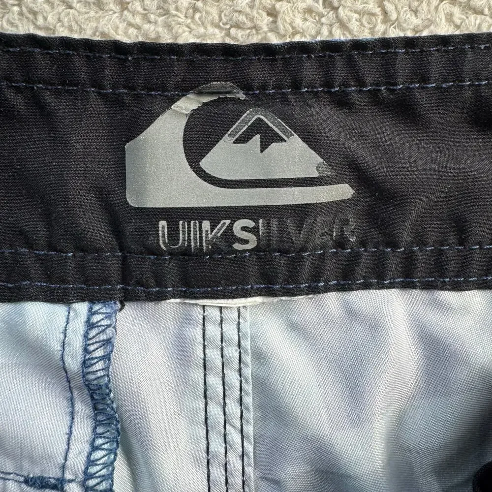 Quiksilver Board Shorts Featuring a Checkerboard Top and a Gradient Bottom
